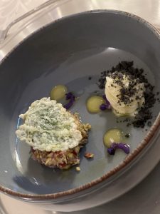 prawn tartare with organic strawberries, crispy mint leaf, lemon mouse and blown butter with squid ink brittle