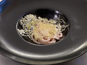 Prawn tails, concentrated, candied cherry tomatoes, Kramar's mountain cheese web, lemon-infused olive oil