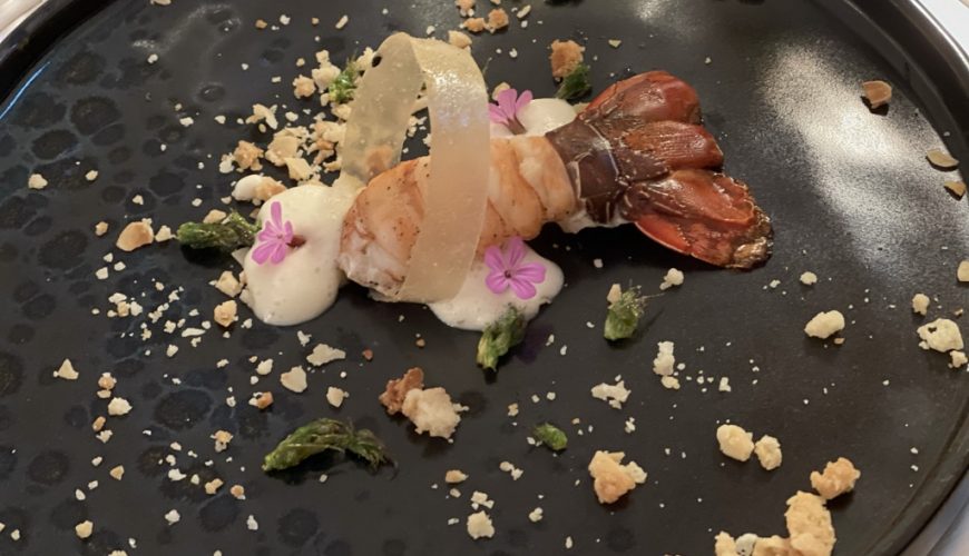 Spiny lobster with almond mousse and crumble, garlic-infused ring and fried asparagus tips